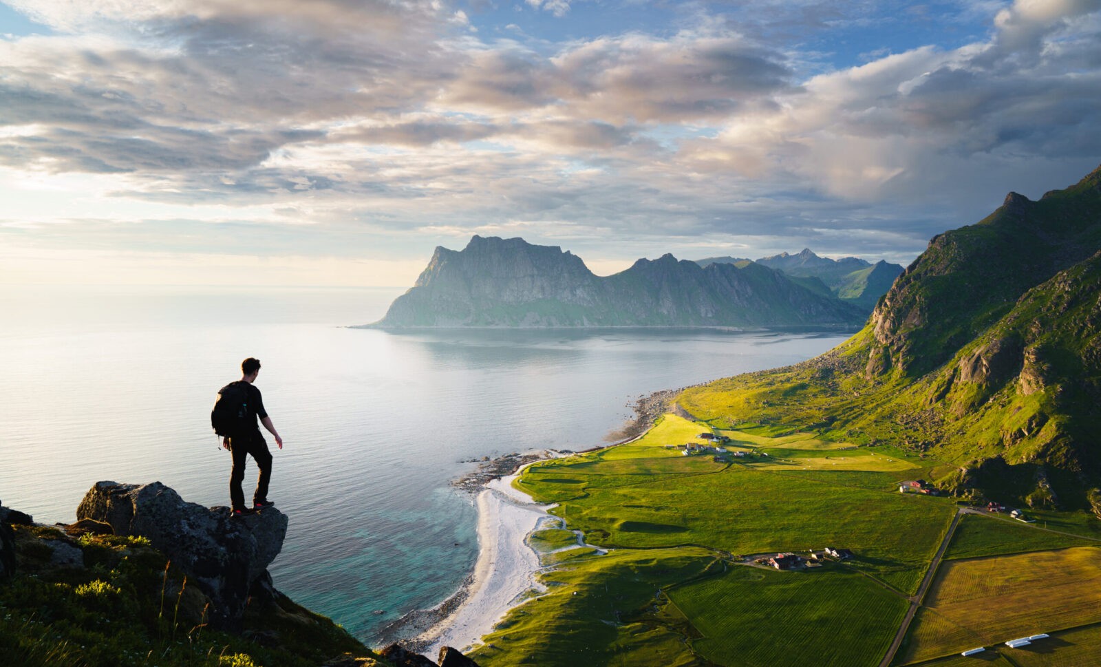 Adventure travel in Norway: scenic sunset hike in Lofoten Islands.