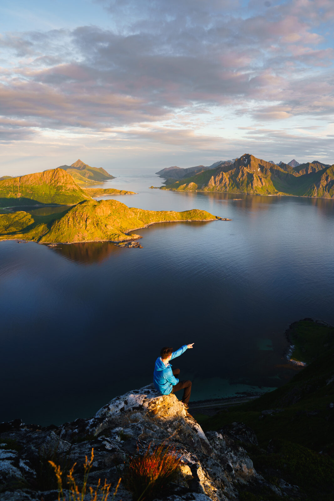 Adventurer Overlooking Stunning Coastal Landscape at Sunset